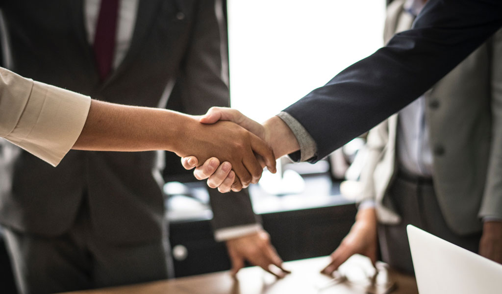 Business partners shaking hands